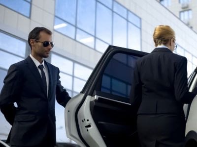 Executive opening car door