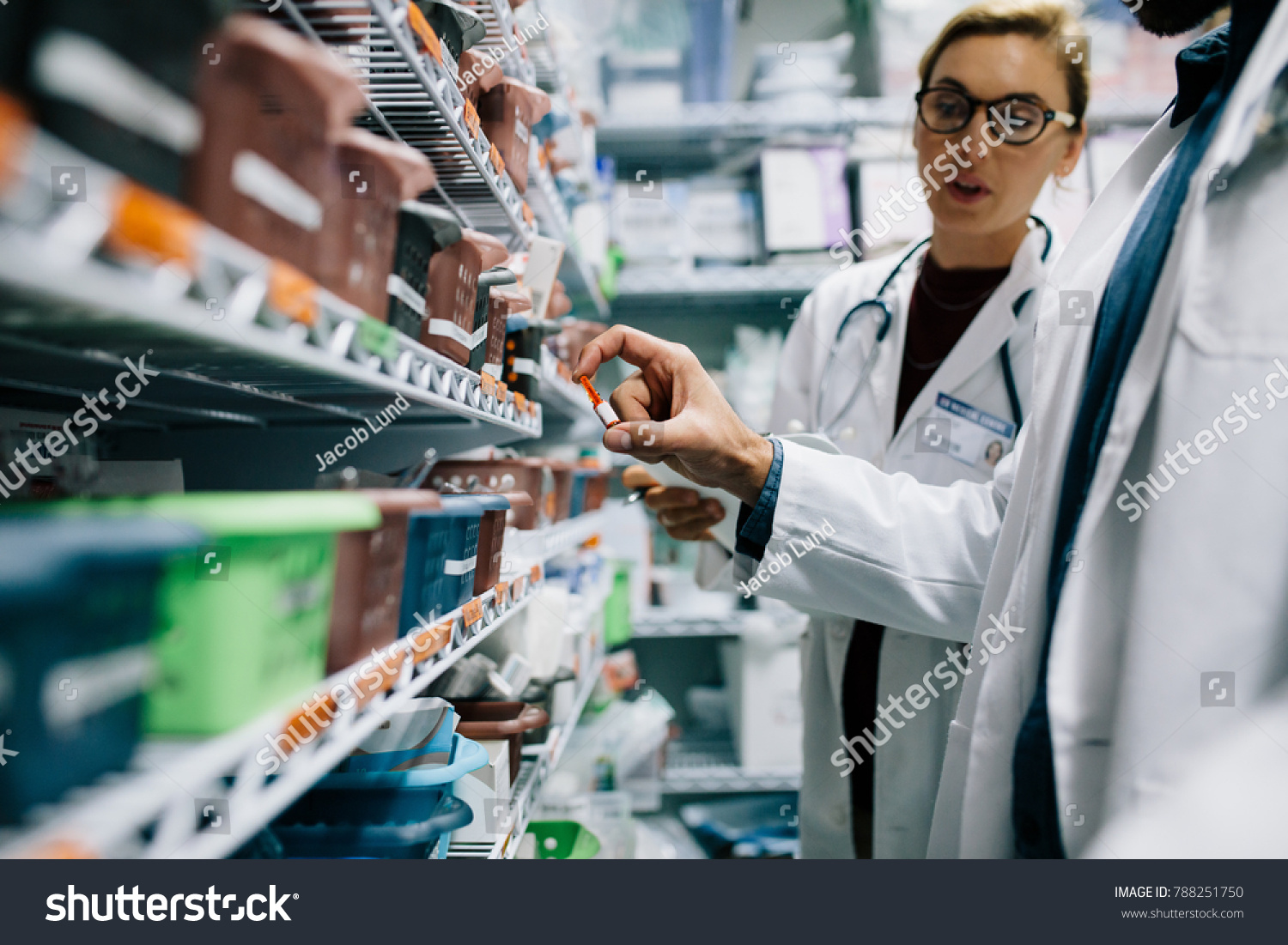 Two Pharmacists Checking Inventory at Hospital Pharmacy